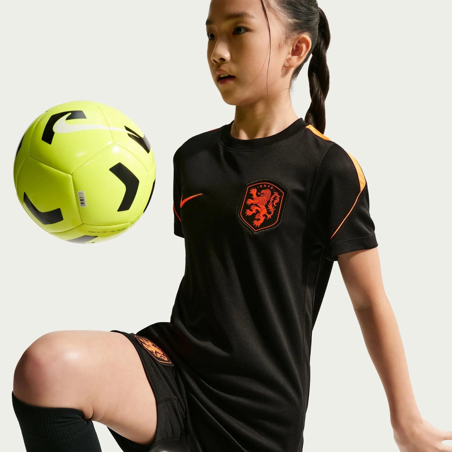 2026-27 Netherlands Youth Strike Top Black/Hyper Crimson/Hyper Crimson